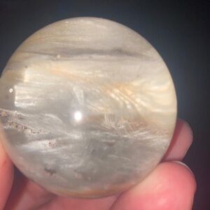 White/grey rabbit hair sphere with a little bit of 3 garden quartz